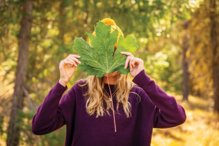 Girl Holding Leaf in Front of Her Face Tumble Creek Scene Portraits Edit