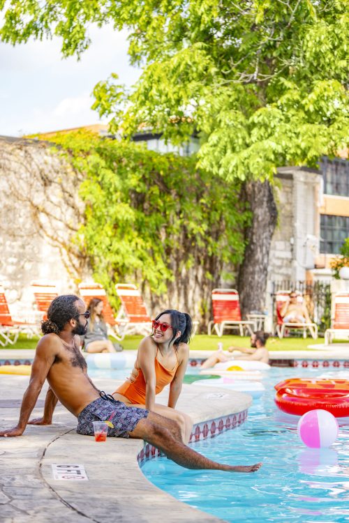 Couple Relaxing Poolside