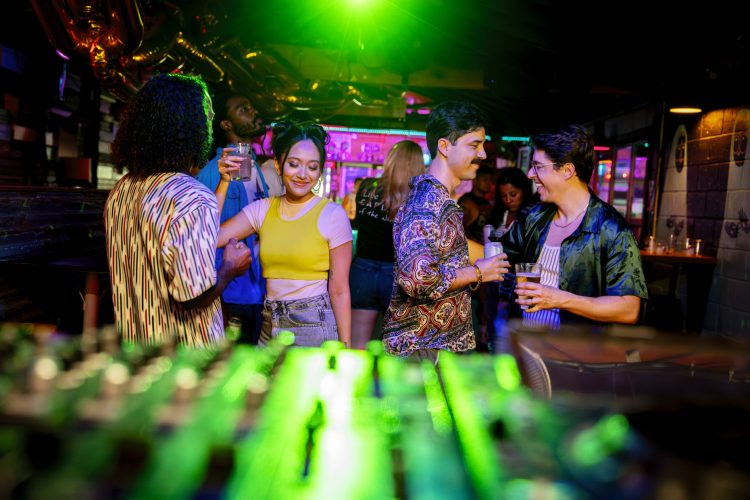 Couples Dancing in Nightclub with green light