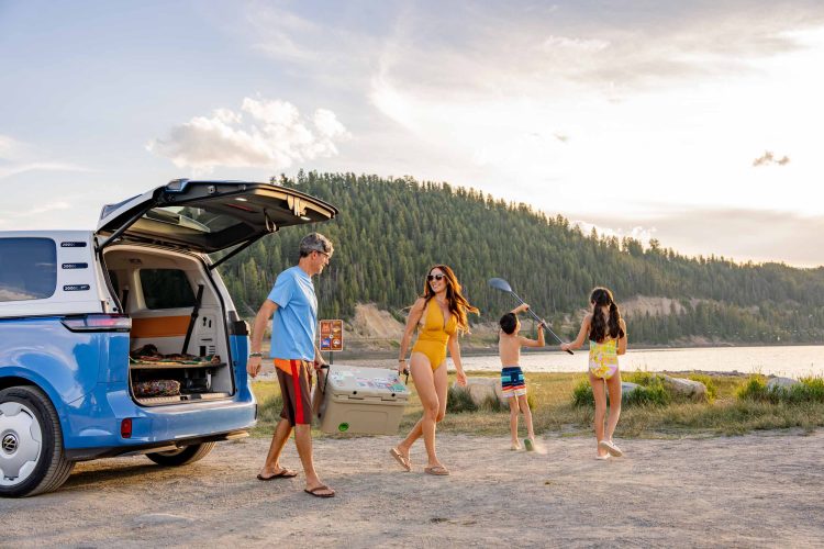 Family Unloading Van by Lake