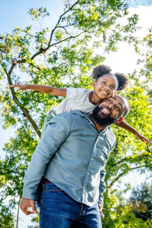 Dad and Daughter Playing in Park