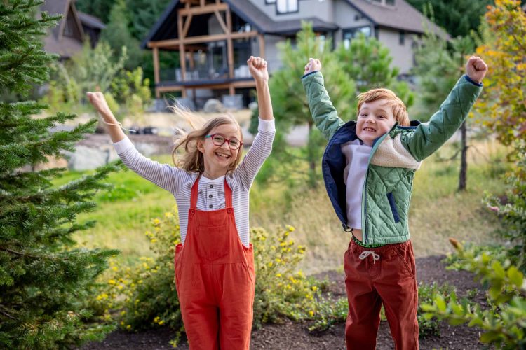 Excited Kids Jumping Outside