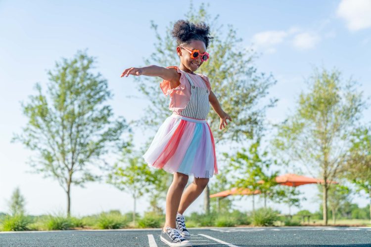 Girl Twirling at Park