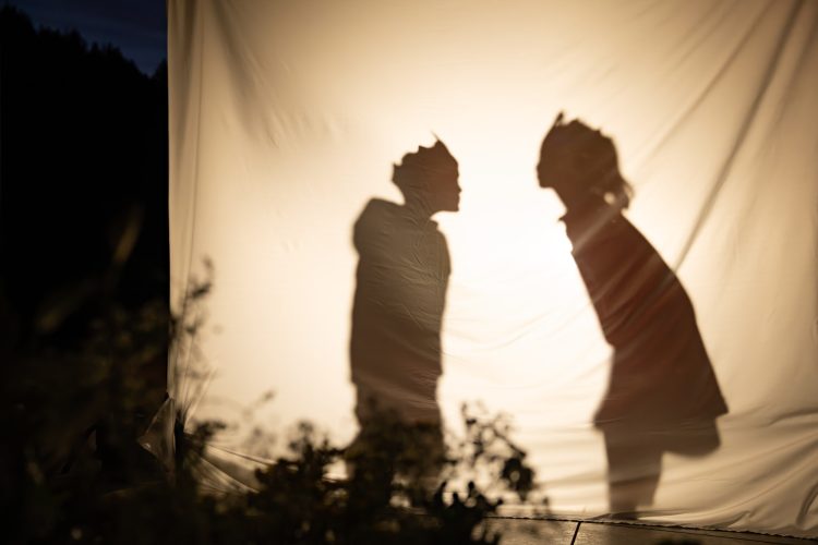 Silhouettes of Children Through Fabric