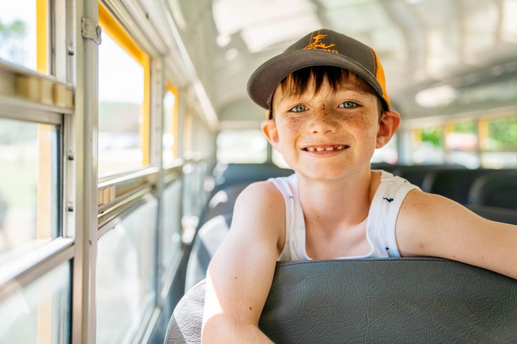 Smiling Boy School Bus