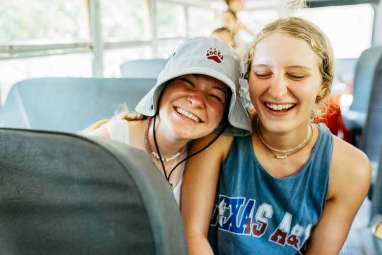 Teens Laughing on Bus