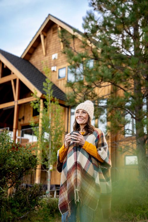Woman Enjoying Outdoors in Front of House