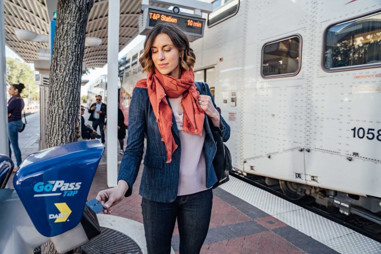 Woman Paying for Train by Tapping Card
