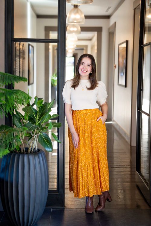 Woman Standing in Hallway