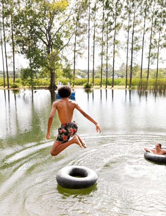 Boy jumping in Texas lake