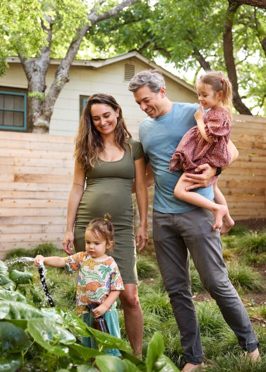 family watering garden