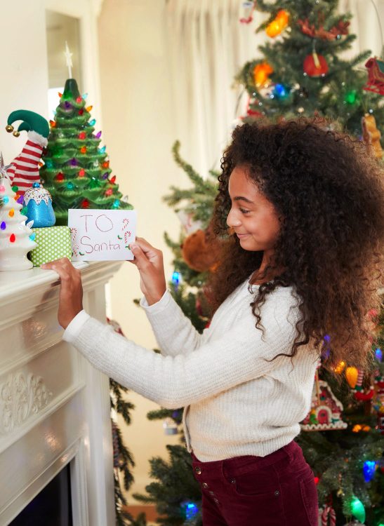 girl leaving note for santa