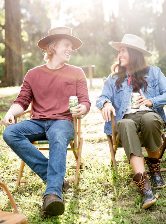young Texas couple drinking beer smiling