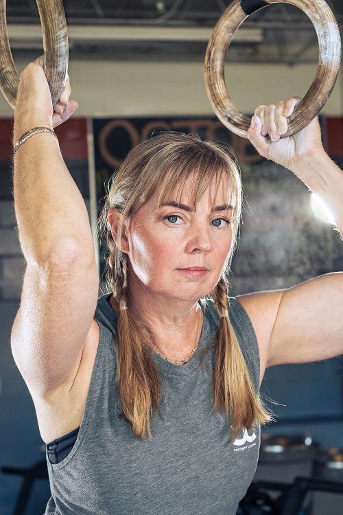 blonde woman braids chalked hands rings