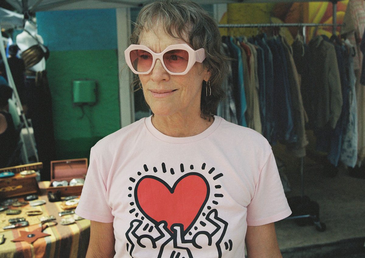 elder woman sunglasses keith haring shirt