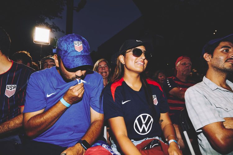man wiping mouth woman with sunglasses austin