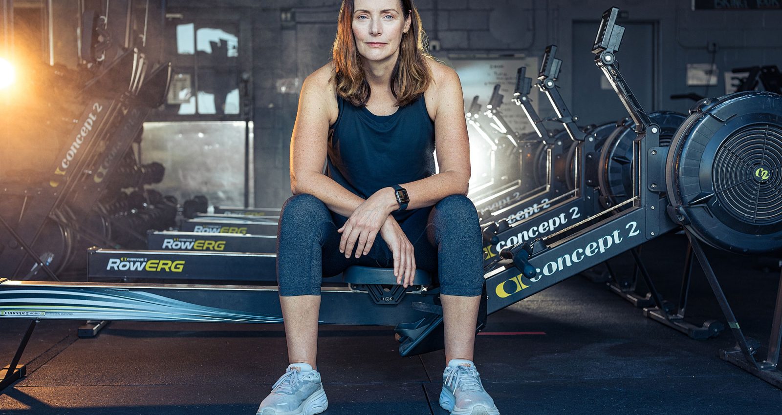 woman athlete rowing machine austin