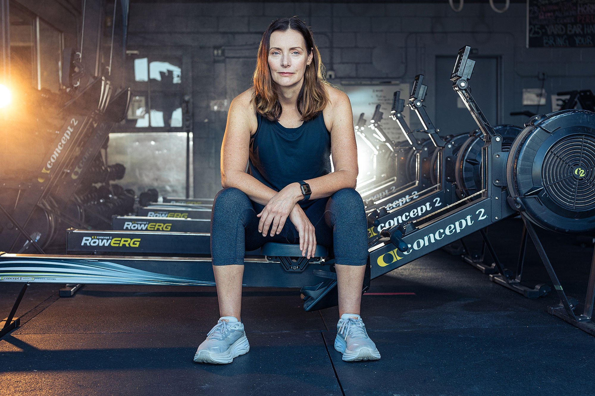 woman athlete rowing machine austin