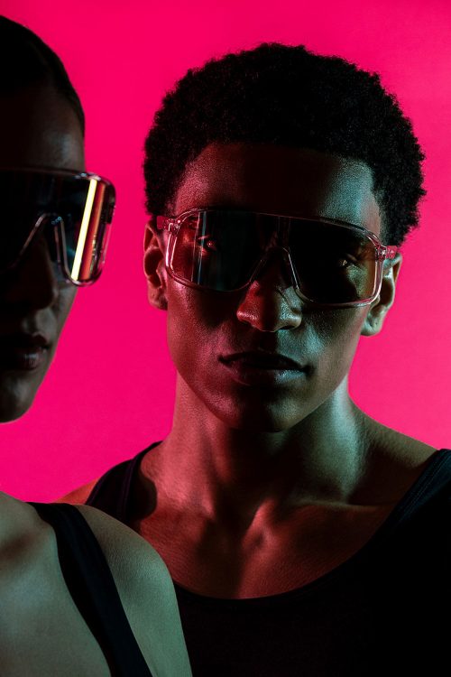 woman man wearing glasses in dark shadow