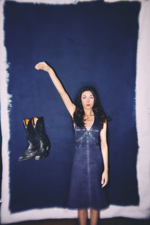 woman western denim dress dropping boots
